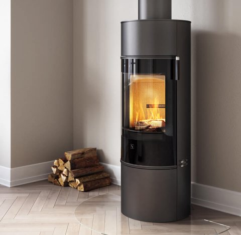 Scan 84 black fireplace with glass door with possibility of rotating base, in bright nordic living room