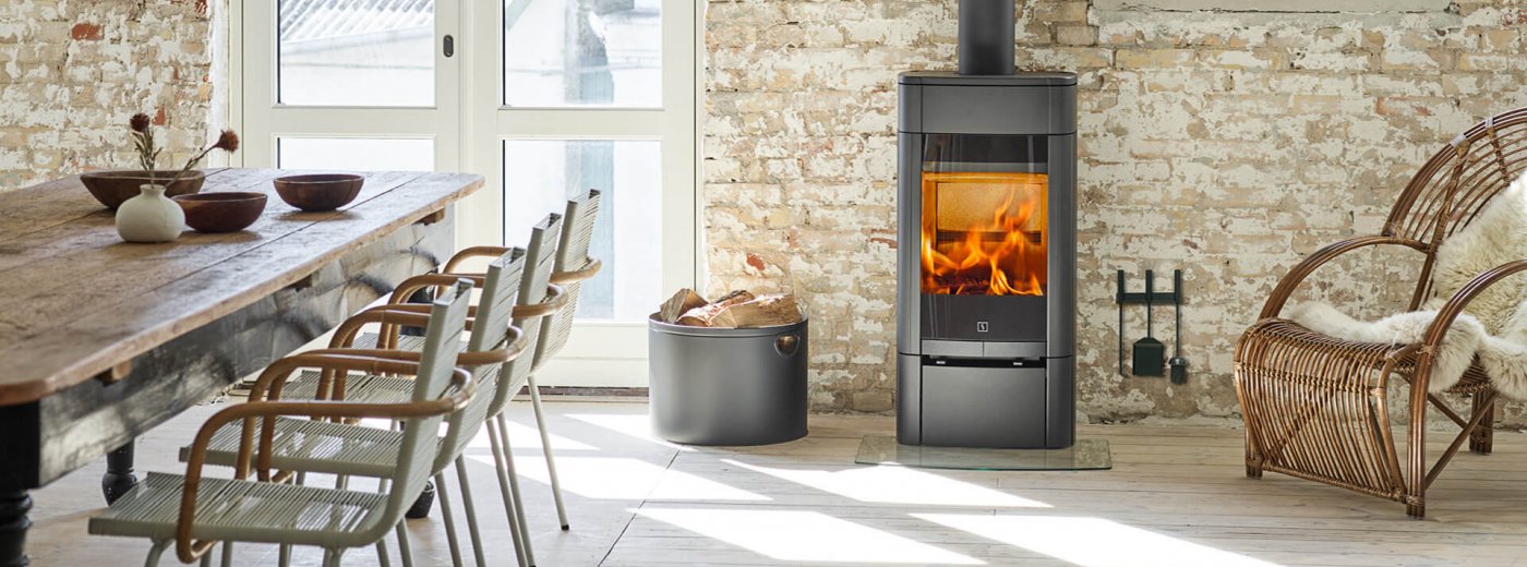 Scan 65-1 in Scandinavian interior in front of a light brick wall